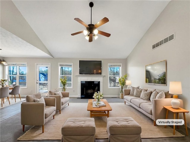 living room with high vaulted ceiling and ceiling fan