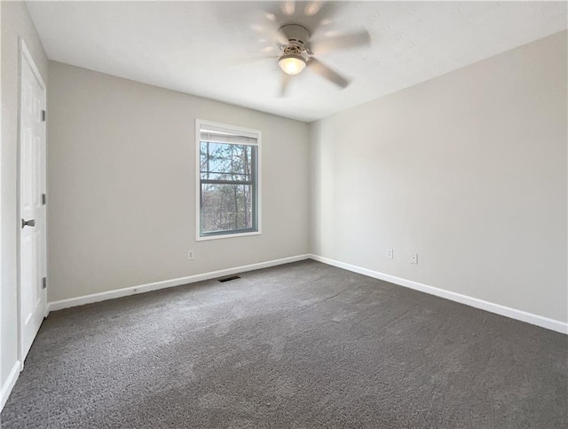 carpeted empty room with ceiling fan