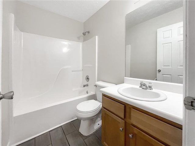 full bathroom with shower / bathtub combination, vanity, and toilet