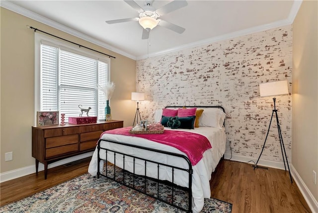 bedroom featuring dark hardwood / wood-style flooring, ornamental molding, and ceiling fan