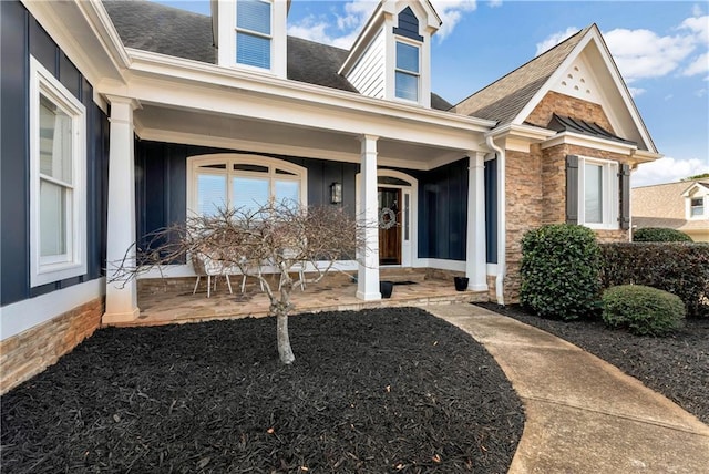 doorway to property featuring a porch