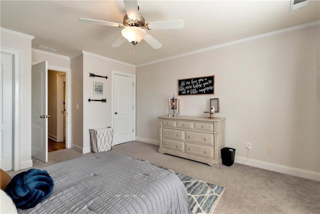 carpeted bedroom featuring ornamental molding and ceiling fan