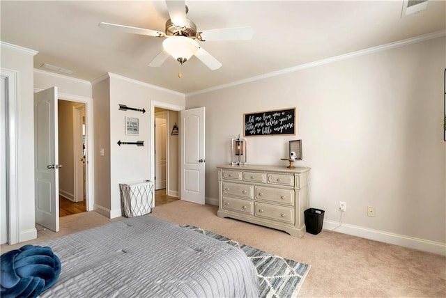 carpeted bedroom featuring ornamental molding and ceiling fan