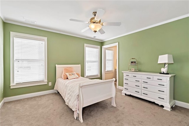 bedroom with crown molding, light colored carpet, and ceiling fan