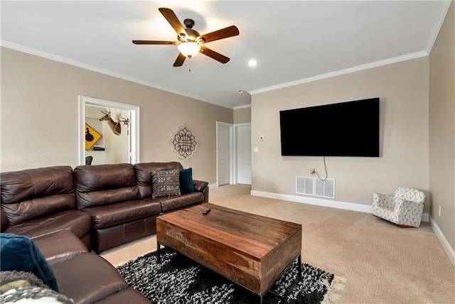 living room featuring ceiling fan, light colored carpet, and ornamental molding