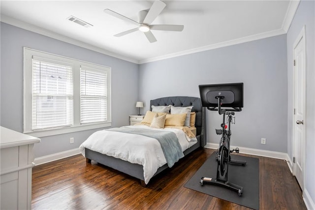 bedroom with baseboards, visible vents, a ceiling fan, dark wood-type flooring, and crown molding