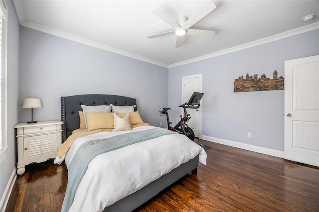 bedroom with dark wood-style floors, crown molding, baseboards, and a ceiling fan