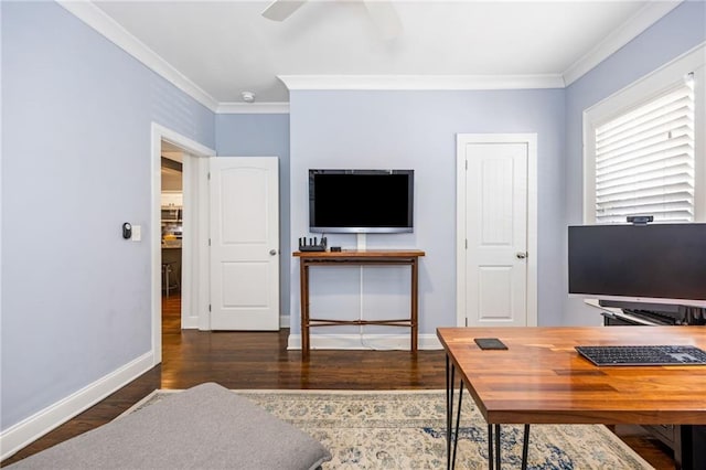 office space with dark wood-style floors, ornamental molding, a ceiling fan, and baseboards