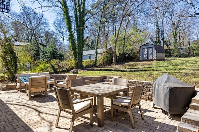 view of patio / terrace featuring an outbuilding, outdoor dining area, a storage unit, outdoor lounge area, and area for grilling