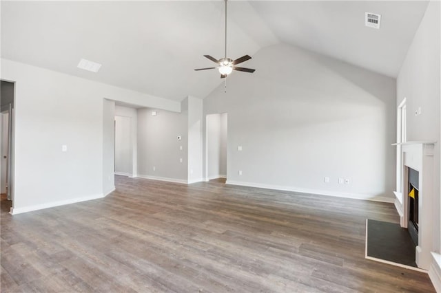 unfurnished living room featuring ceiling fan, dark hardwood / wood-style flooring, and high vaulted ceiling