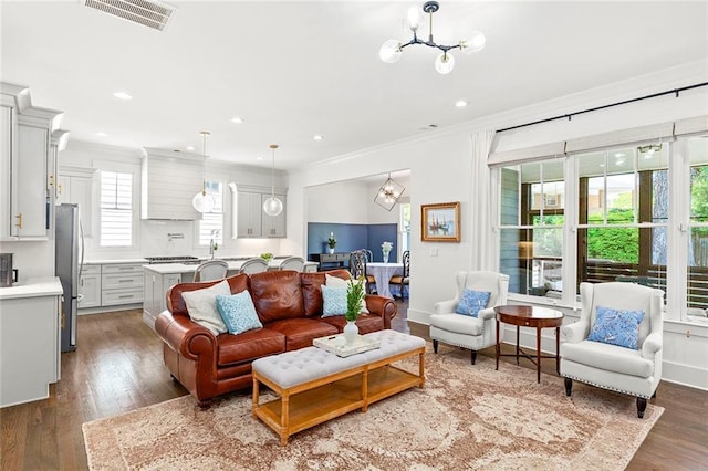 259 Sisson Ave, Atlanta, GA 30317 - living room featuring a chandelier, dark wood-style flooring, ornamental molding, and recessed lighting