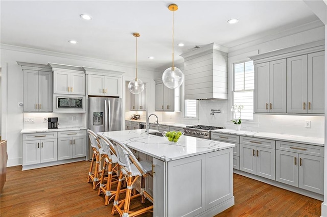 259 Sisson Ave, Atlanta, GA 30317 - kitchen with appliances with stainless steel finishes, gray cabinetry, crown molding, tasteful backsplash, and wood finished floors