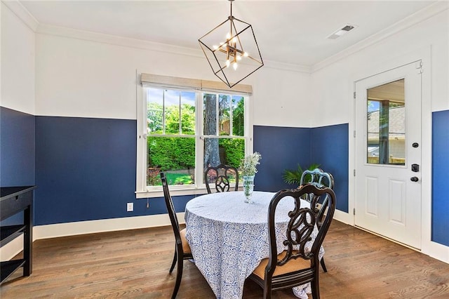 259 Sisson Ave, Atlanta, GA 30317 - dining room with a chandelier, wood finished floors, and ornamental molding