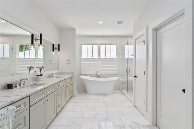 259 Sisson Ave, Atlanta, GA 30317 - full bath with plenty of natural light, a freestanding tub, double vanity, a stall shower, and recessed lighting