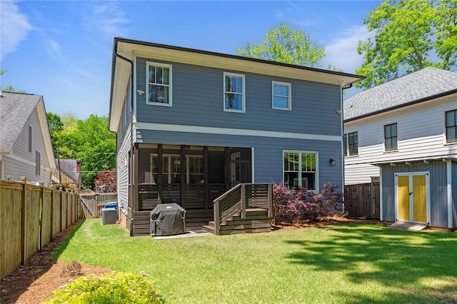 259 Sisson Ave, Atlanta, GA 30317 - back of property with a fenced backyard, a sunroom, and an outbuilding
