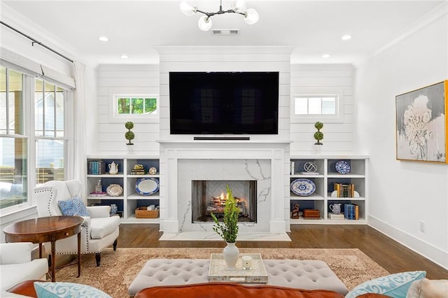 259 Sisson Ave, Atlanta, GA 30317 - living room featuring wood finished floors, a fireplace, healthy amount of natural light, and recessed lighting