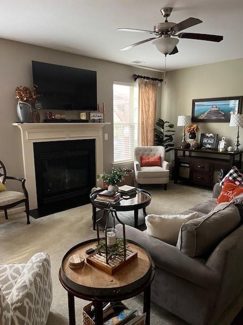 living room with light colored carpet and ceiling fan