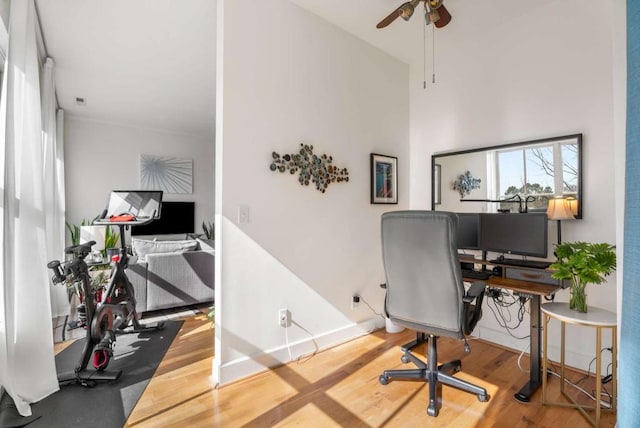 office area with ceiling fan and wood-type flooring