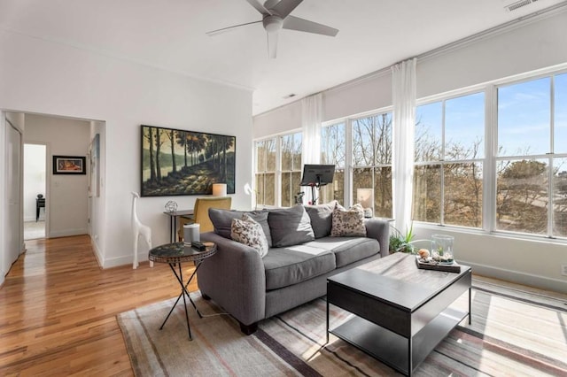 interior space with ceiling fan