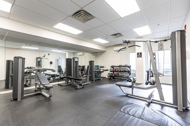 gym featuring a drop ceiling