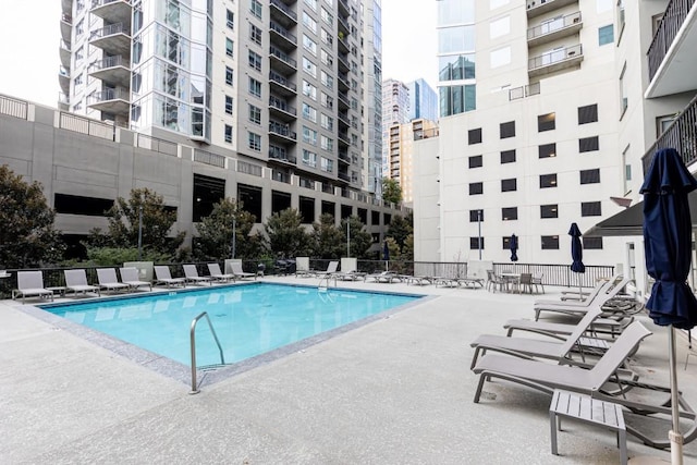 view of swimming pool featuring a patio area