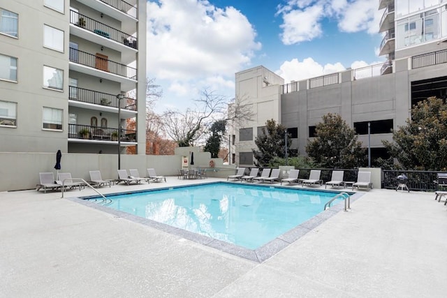 view of swimming pool featuring a patio area