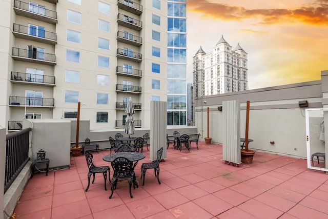 view of patio terrace at dusk