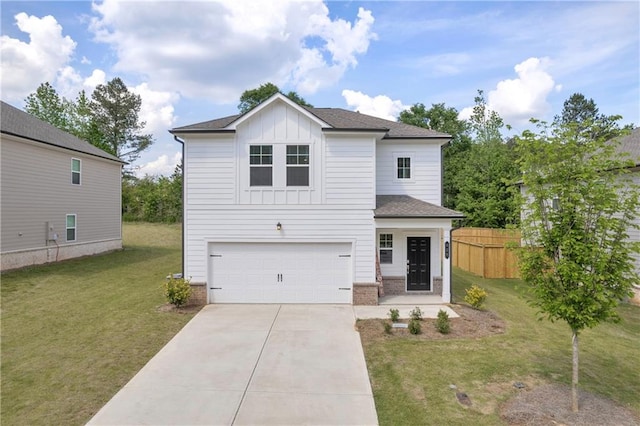 view of front of property with an attached garage, board and batten siding, a front yard, and concrete driveway
