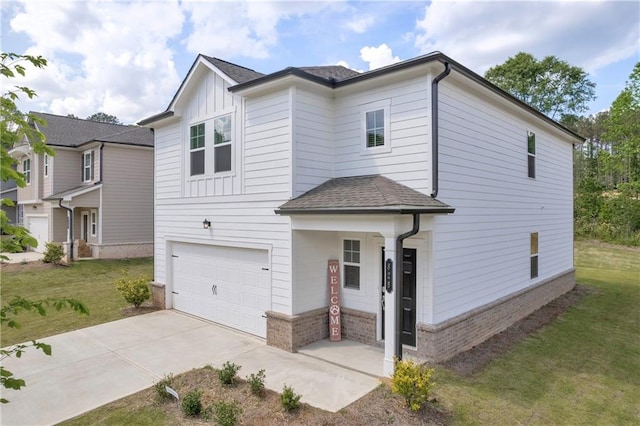 view of front of house featuring an attached garage, brick siding, driveway, and a front yard