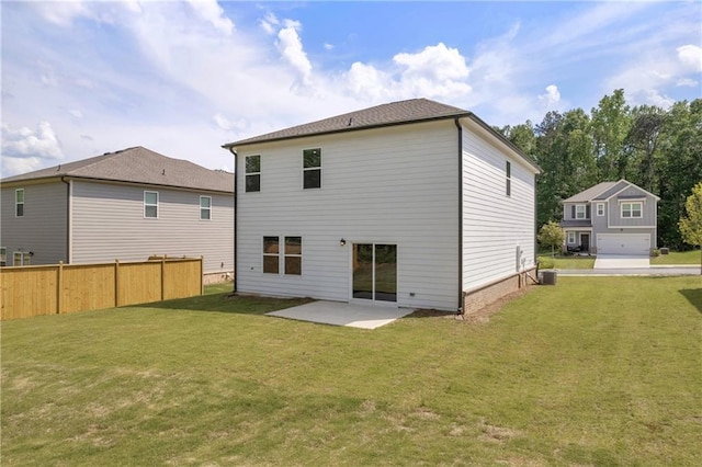 back of property with fence, a yard, a patio area, and cooling unit