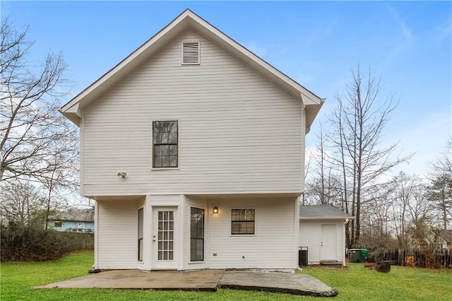 back of house with a yard, a patio, and central AC