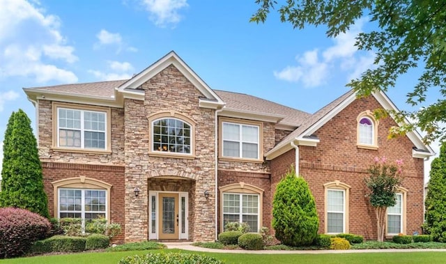 3843 Dragon Fly Ln, Loganville, GA 30052 - view of front of home with a front lawn and stone siding