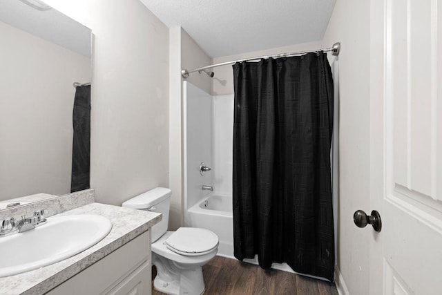 full bath featuring shower / bath combo with shower curtain, toilet, wood finished floors, and vanity