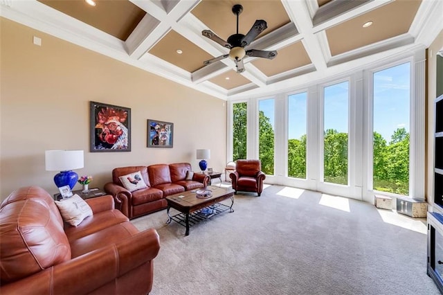 living room featuring light colored carpet, beamed ceiling, and ornamental molding