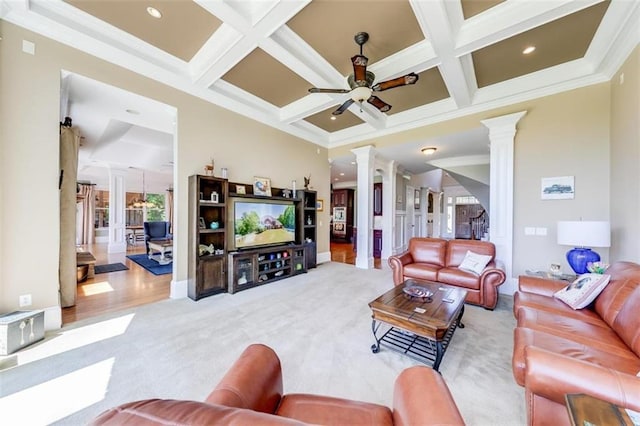 living room with beamed ceiling, ceiling fan, decorative columns, light colored carpet, and coffered ceiling