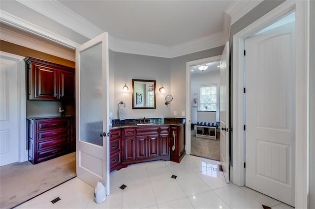 bathroom featuring tile patterned floors, vanity, and ornamental molding