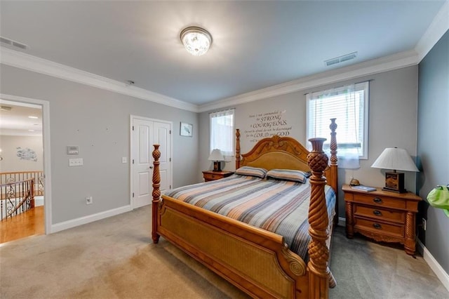 carpeted bedroom featuring a closet and ornamental molding