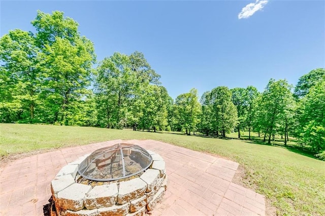 view of patio featuring a fire pit