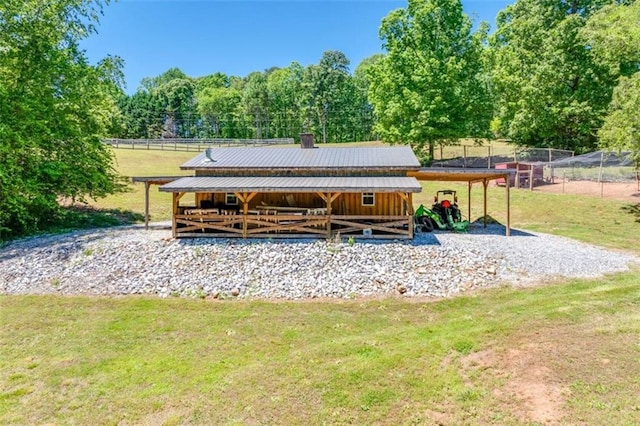 exterior space featuring a rural view and an outdoor structure