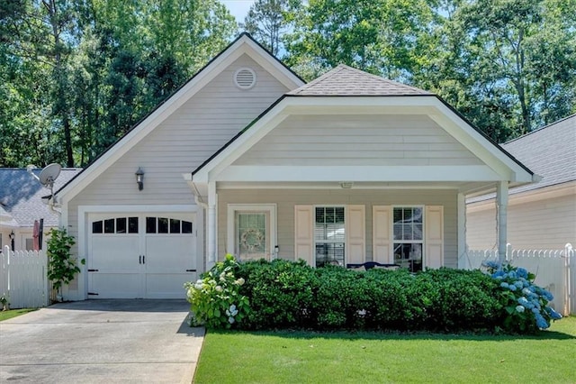 227 Katherine Ct, Carrollton, GA 30117 - view of front of home with an attached garage, driveway, and roof with shingles