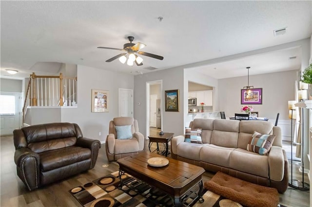 113 Regent Pl, Woodstock, GA 30188 - living area with a ceiling fan, wood finished floors, and stairs