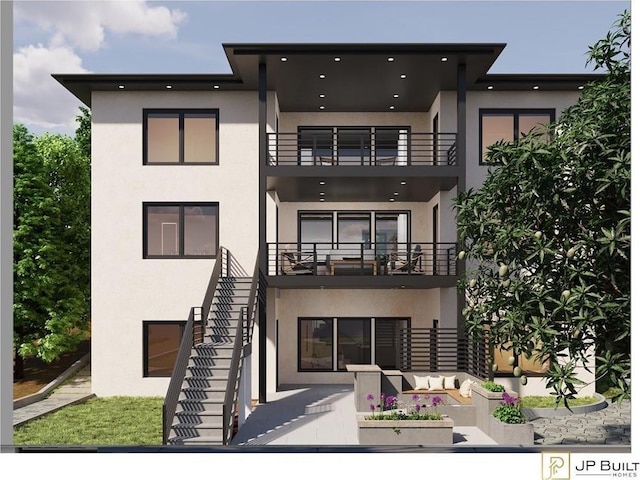 4109 Abbotts Bridge Rd, Duluth, GA 30097 - back of house with a balcony, stucco siding, outdoor lounge area, and stairway