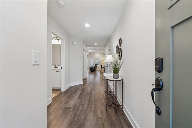 entryway with ceiling fan, baseboards, wood finished floors, and recessed lighting