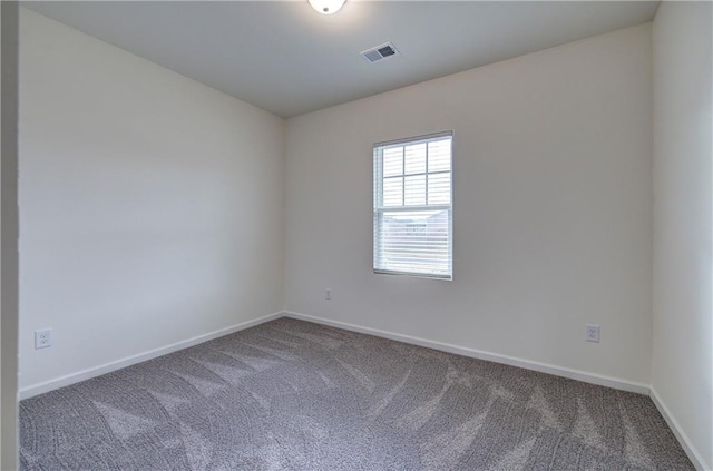 empty room featuring carpet floors