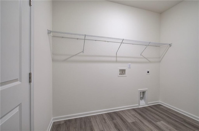 clothes washing area featuring hookup for a washing machine, hardwood / wood-style flooring, and hookup for an electric dryer