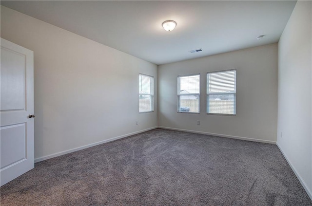 unfurnished room featuring carpet flooring