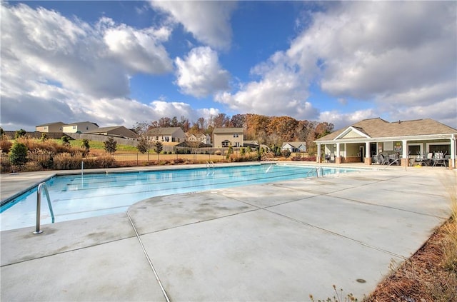 view of swimming pool with a patio