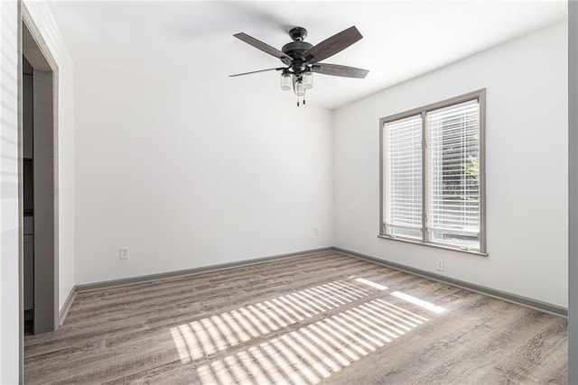 26 Ivy Pkwy NE, Atlanta, GA 30342 - unfurnished room featuring wood finished floors, ceiling fan, and baseboards