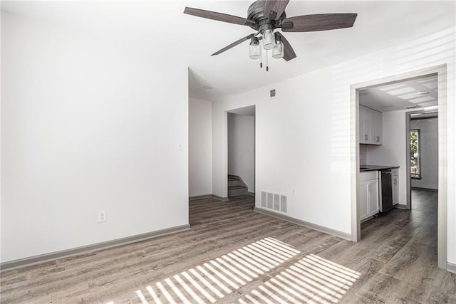26 Ivy Pkwy NE, Atlanta, GA 30342 - unfurnished room featuring light wood-style flooring, baseboards, and ceiling fan