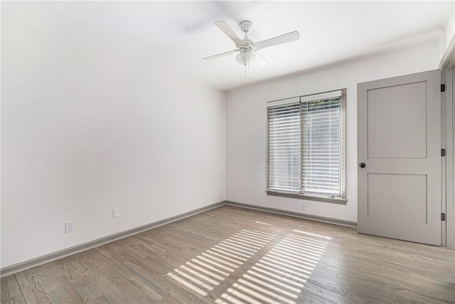26 Ivy Pkwy NE, Atlanta, GA 30342 - spare room with wood finished floors, a ceiling fan, and baseboards